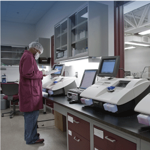 Lab-tech-working-on-analyzer Streamlined Workflows for screening and LCMS.